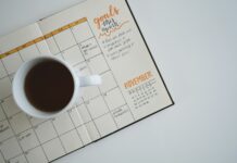 적절한 체중관리를 통한 건강관리 white ceramic mug with coffee on top of a planner
