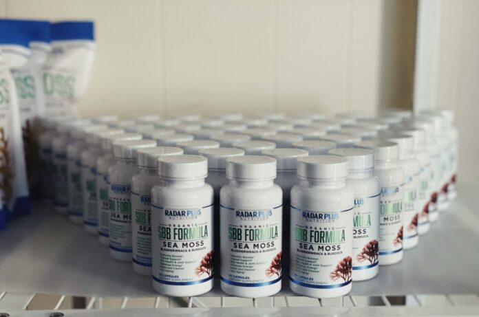 Photo by Hey Beauti Magazine white plastic bottle on white table